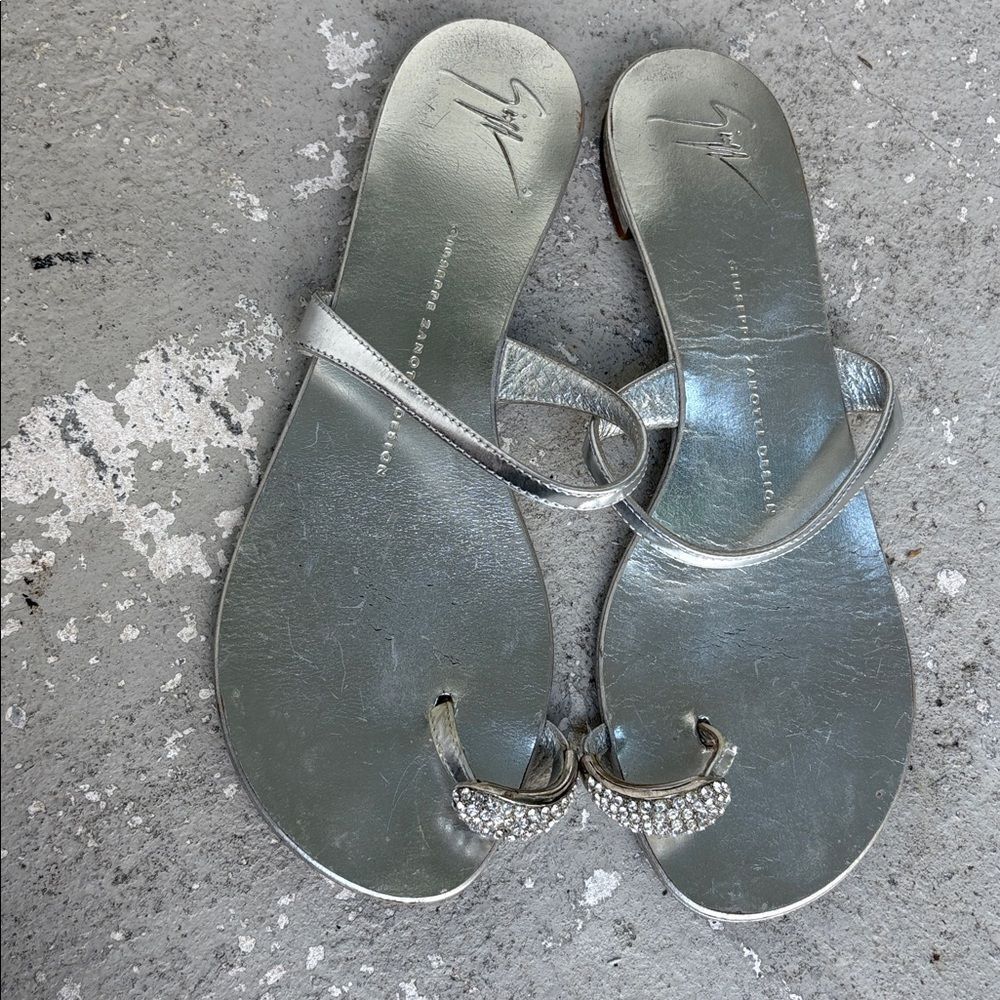 Giuseppe’s silver rhinestone toe ring flats